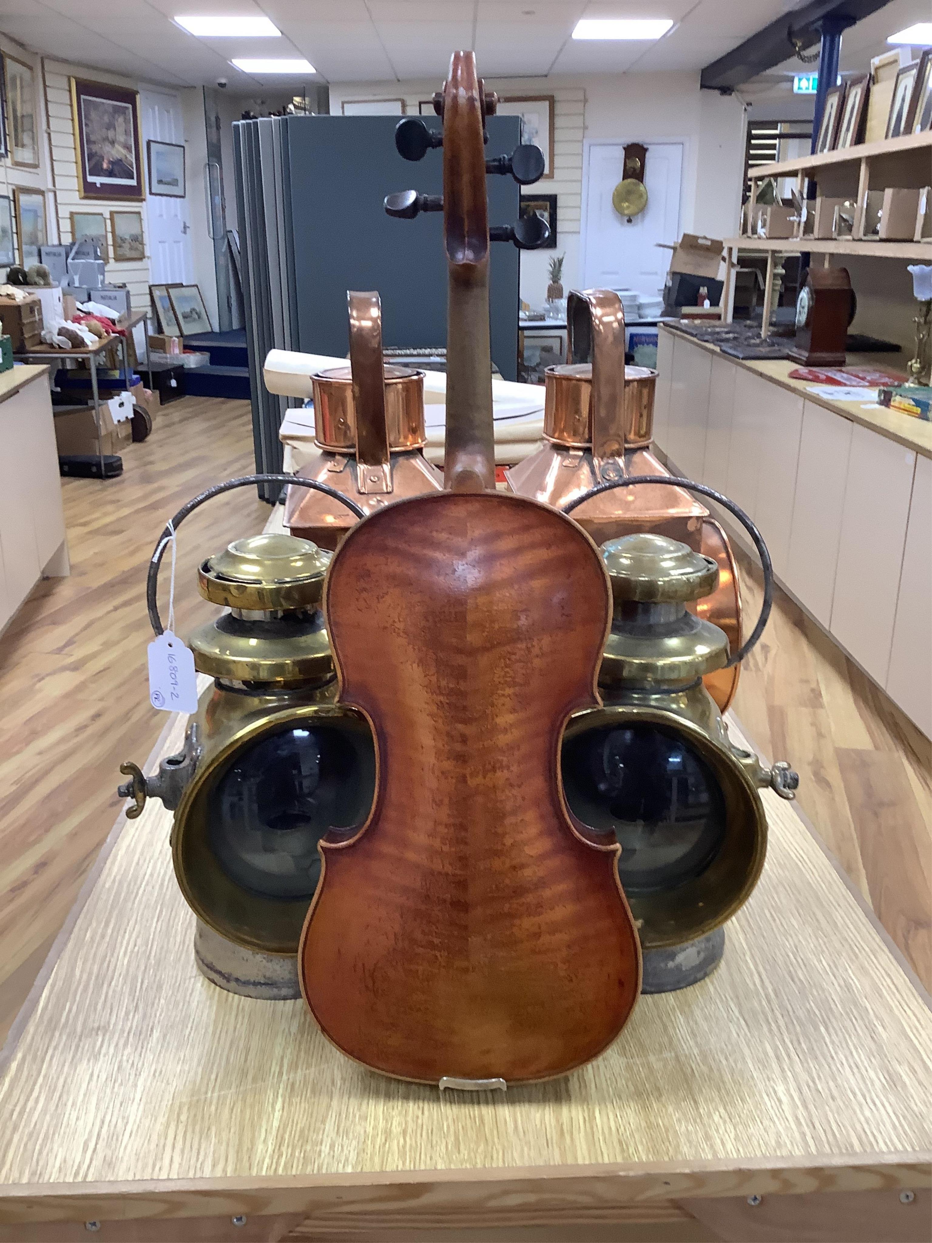 A late 19th cased century French unmarked violin and bow, body 35cm high.